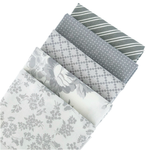 The Dwell Gray Fat Quarter Bundles includes gray and white fabric from designed by Camille Roskelley for Moda Fabrics. 