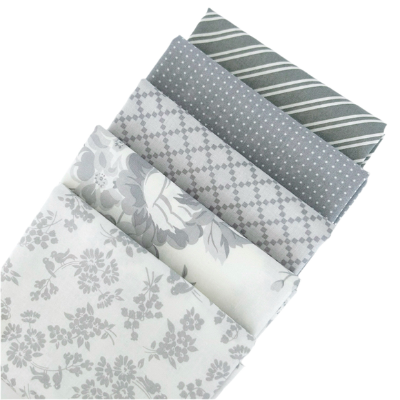 The Dwell Gray Fat Quarter Bundles includes gray and white fabric from designed by Camille Roskelley for Moda Fabrics. 