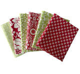Five fabric swatches with red and green patterns on a white background