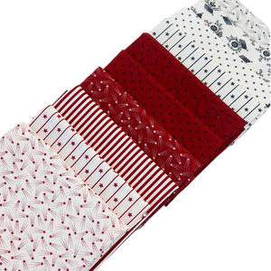 The Patriotic Fat Quarter Bundle by Primitive Gatherings includes red, white, and blue quilting fabrics designed for Moda Fabrics.