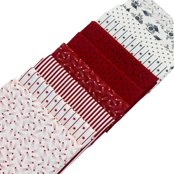 The Patriotic Fat Quarter Bundle by Primitive Gatherings includes red, white, and blue quilting fabrics designed for Moda Fabrics.