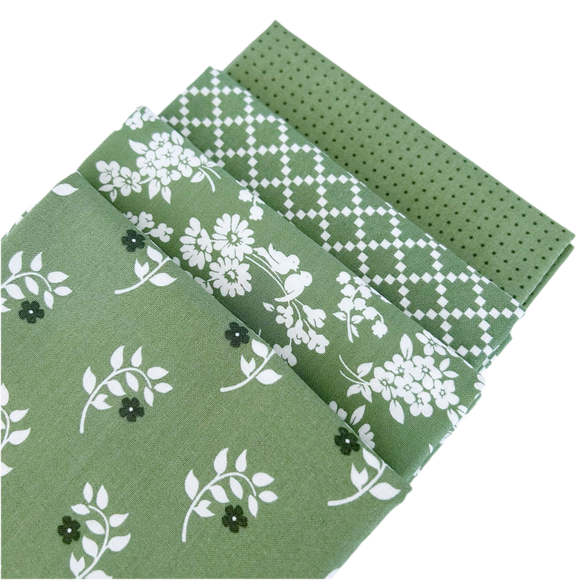 The Dwell Green Fat Quarter Bundle includes 4 fat quarters designed by Camille Roskelley for Moda Fabrics.