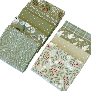 The Christmas Eve Green Fat Quarter Bundle includes green quilting fabric designed by Lella Boutique for Moda Fabrics.