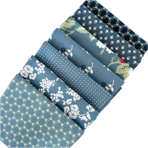 The Dusty blues fat quarter bundle includes a curated mix of prints from the Dwell fabric collection designed by Camille Roskelley for Moda Fabrics. 