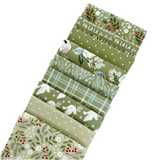 The Christmas Eve Green Fat Quarter Bundle includes green quilting fabric designed by Lella Boutique for Moda Fabrics.